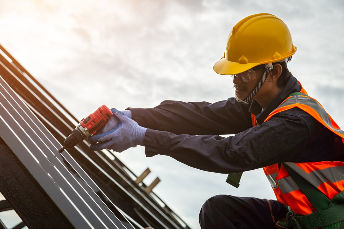 Construction Worker Installing Roof